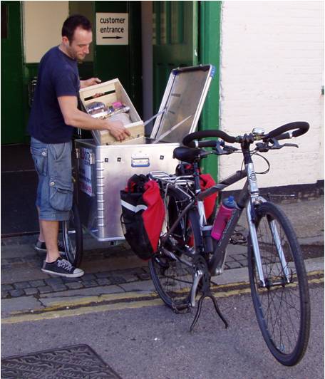 Man from Canterbury Wholefoods loading trailer